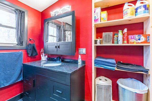 bathroom with plenty of natural light and vanity