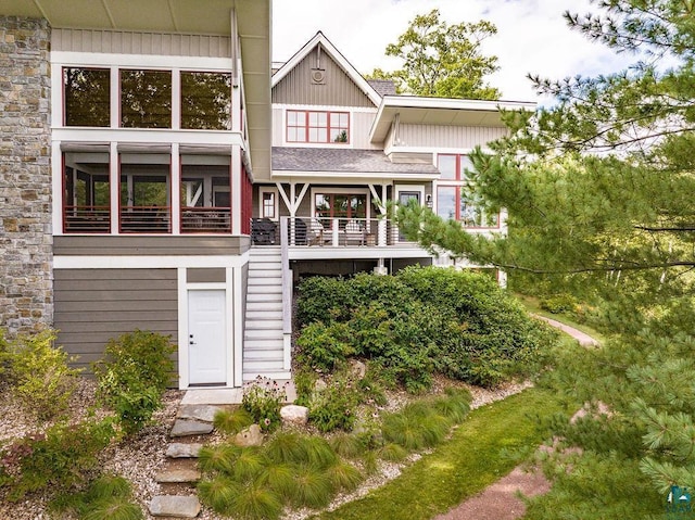 rear view of property with a balcony