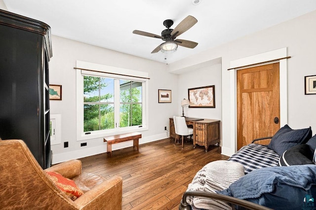 interior space with dark hardwood / wood-style flooring and ceiling fan