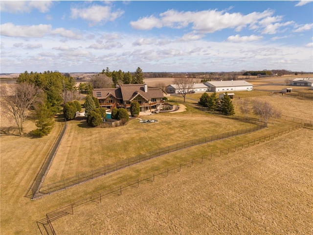 birds eye view of property with a rural view