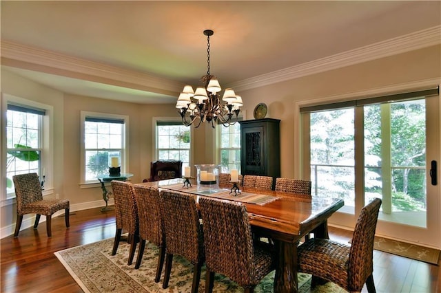 dining area featuring crown molding, a notable chandelier, and dark hardwood / wood-style floors