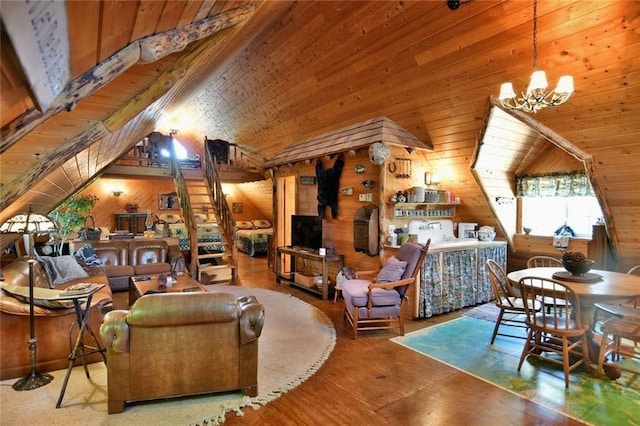 living room with wood walls, a chandelier, and lofted ceiling