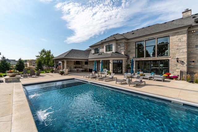 9809 Trappers Trl, Middleton, WI 53562 - view of swimming pool with pool water feature and a patio
