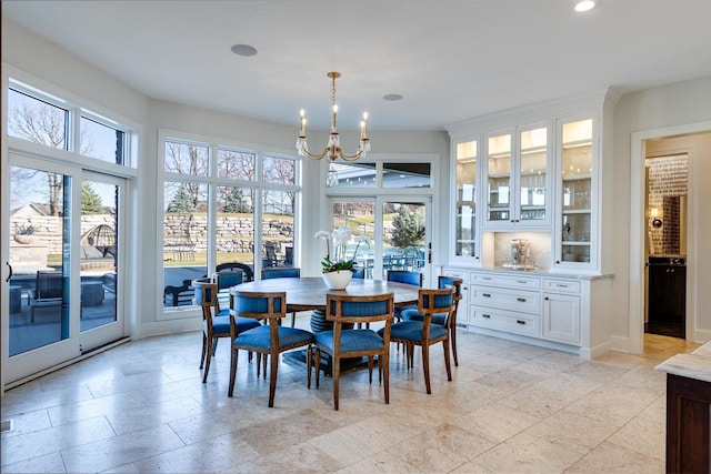 9809 Trappers Trl, Middleton, WI 53562 - tiled dining area with a wealth of natural light and a chandelier