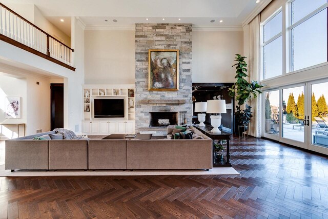 9809 Trappers Trl, Middleton, WI 53562 - living room with dark parquet flooring, a stone fireplace, french doors, and a towering ceiling
