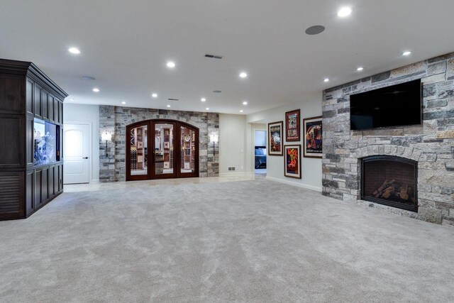 9809 Trappers Trl, Middleton, WI 53562 - unfurnished living room with light colored carpet and a stone fireplace