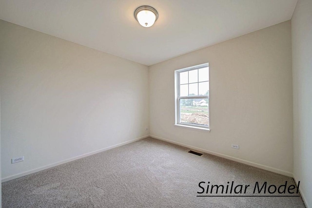 empty room with carpet flooring