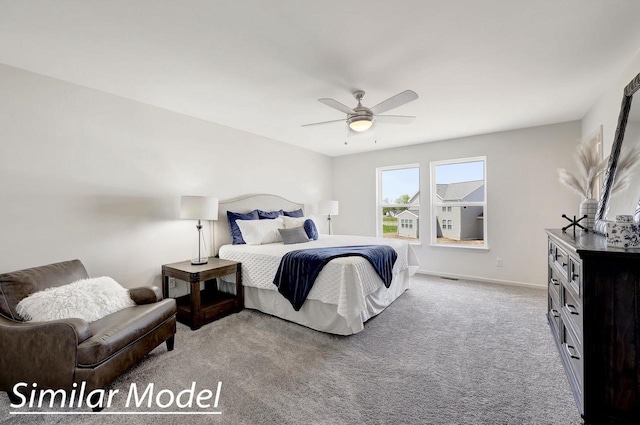 bedroom featuring light carpet and ceiling fan