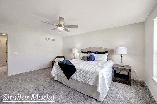 bedroom with ceiling fan and light colored carpet