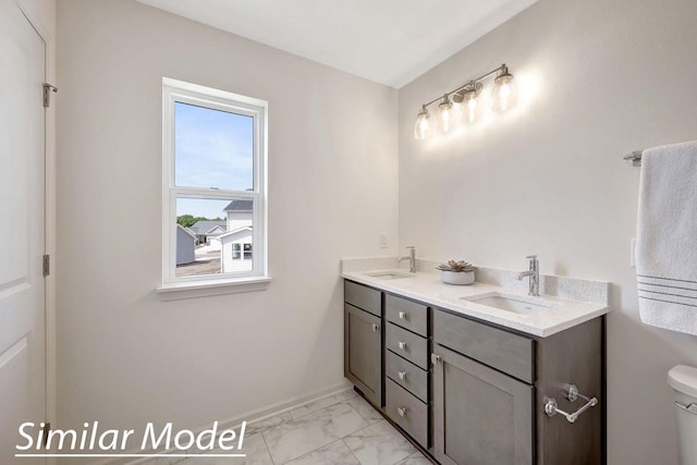 bathroom with vanity and toilet