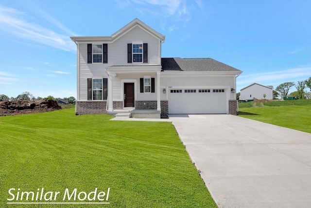 view of front of house with a front yard and a garage