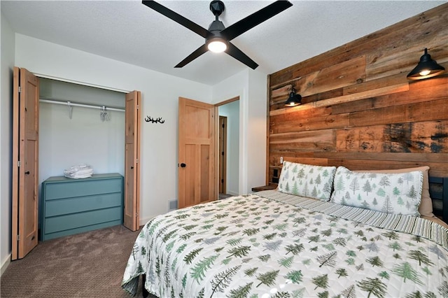 carpeted bedroom with a closet and ceiling fan