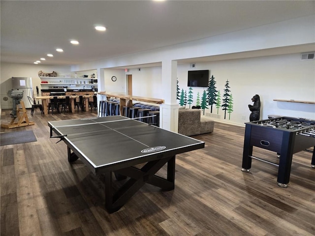 recreation room featuring dark hardwood / wood-style flooring