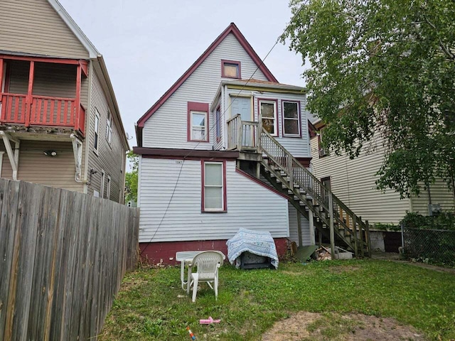 back of house with a yard