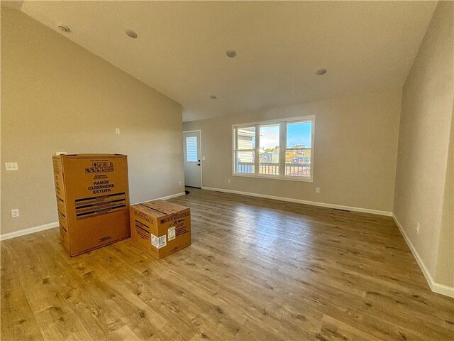 kitchen featuring white cabinets, light wood-type flooring, sink, and stainless steel dishwasher