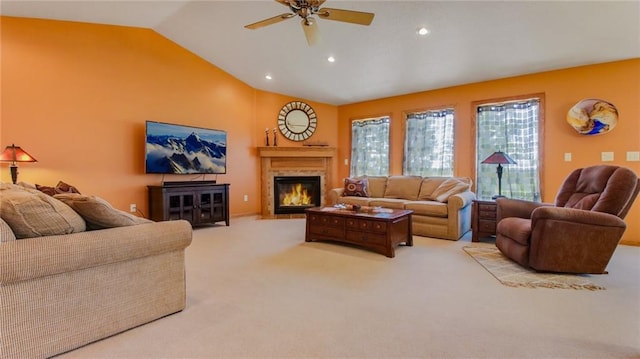 living room with light colored carpet, lofted ceiling, and ceiling fan