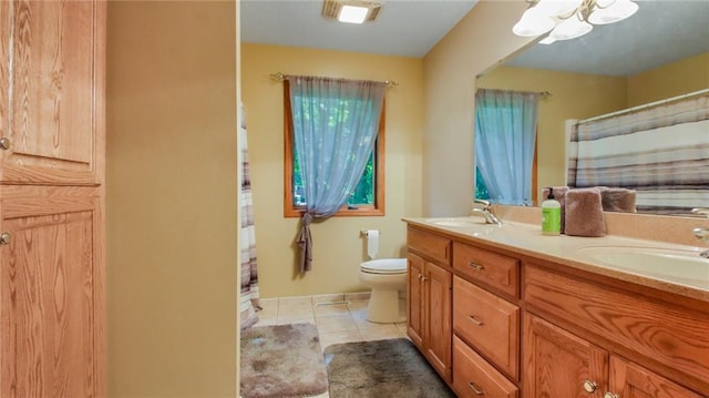 bathroom featuring dual bowl vanity, toilet, and tile floors