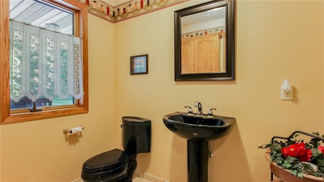 bathroom with toilet and sink