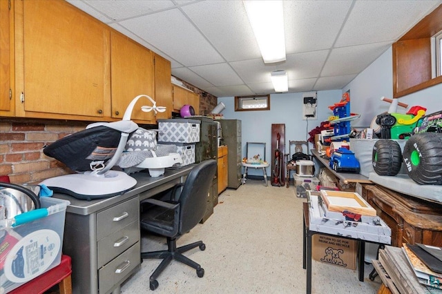 office area featuring a paneled ceiling