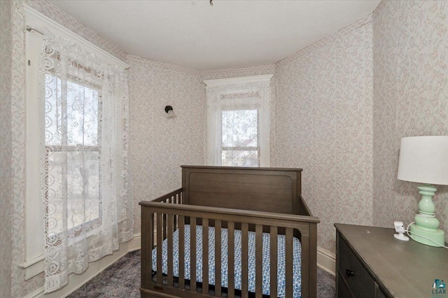 bedroom with a crib and multiple windows