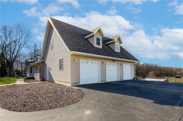 view of side of home with a garage