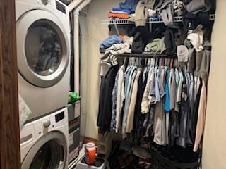 laundry area featuring stacked washing maching and dryer