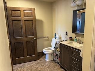 bathroom featuring oversized vanity and toilet