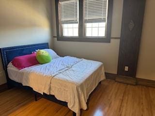 bedroom with hardwood / wood-style floors