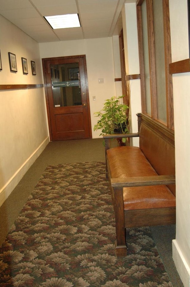 hall with dark carpet