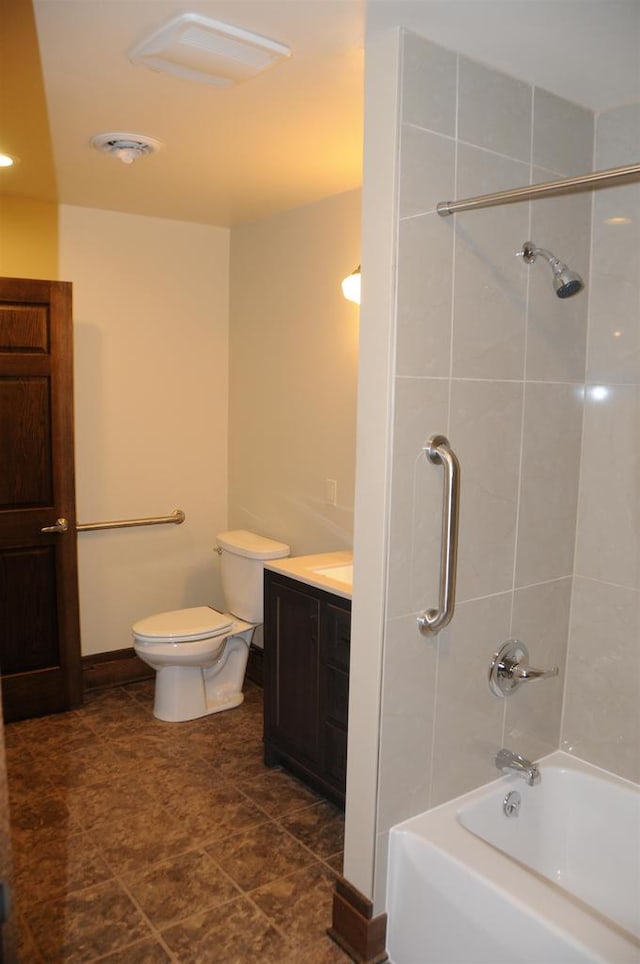 full bathroom featuring tile flooring, vanity, toilet, and bath / shower combo with glass door