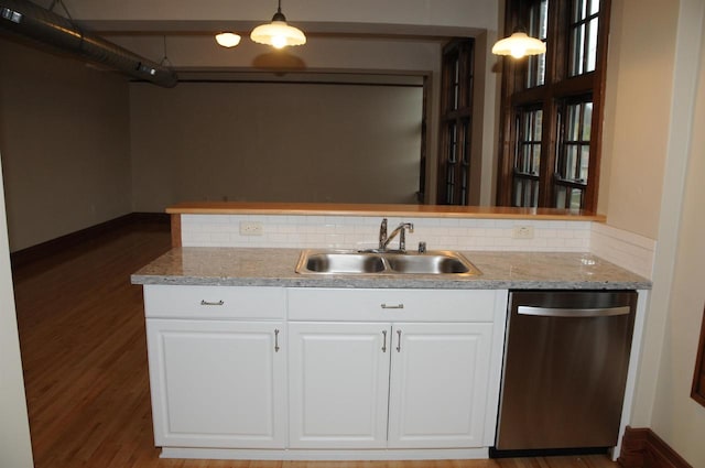 kitchen featuring dark hardwood / wood-style flooring, dishwasher, white cabinetry, and sink