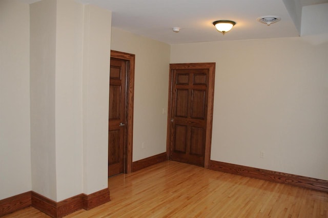 unfurnished room featuring light hardwood / wood-style flooring