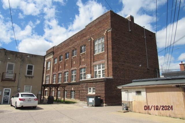 view of building exterior featuring central AC