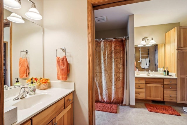 bathroom with tile floors and vanity