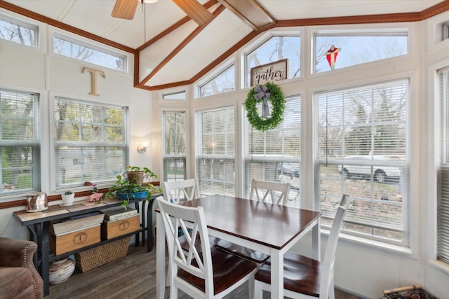 sunroom featuring ceiling fan, plenty of natural light, and lofted ceiling with beams