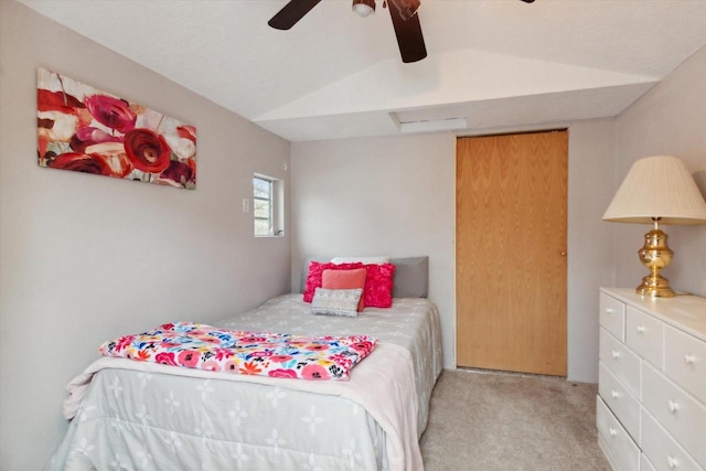 carpeted bedroom with lofted ceiling and ceiling fan