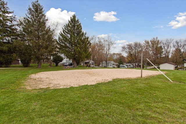 surrounding community featuring volleyball court and a yard