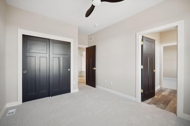 bedroom with wood-type flooring, ceiling fan, and a closet