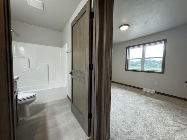 full bathroom with vanity, shower / washtub combination, and toilet