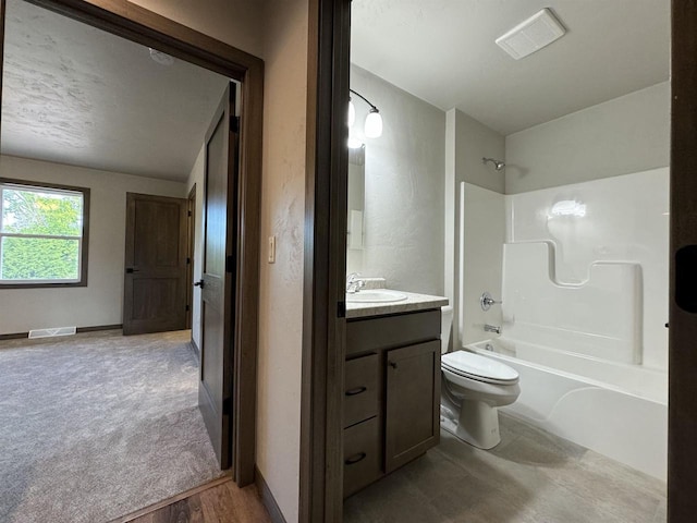 full bathroom with shower / bath combination, vanity, and toilet