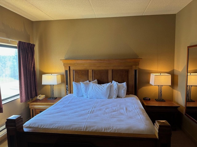 bedroom with a baseboard heating unit