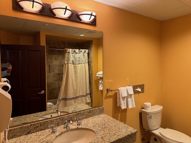 bathroom featuring large vanity and toilet