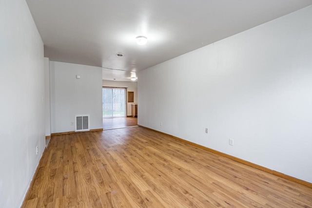 unfurnished room featuring light wood-type flooring