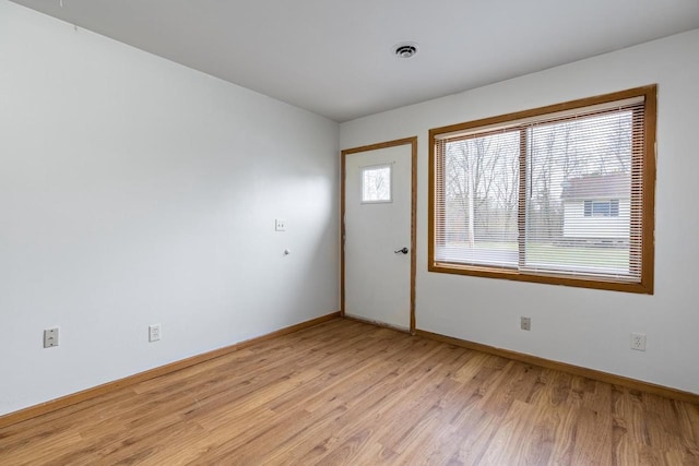 spare room featuring light hardwood / wood-style floors