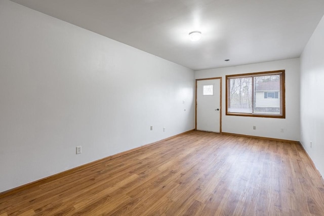 empty room with light wood-type flooring