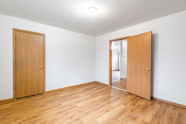 unfurnished room with light hardwood / wood-style flooring