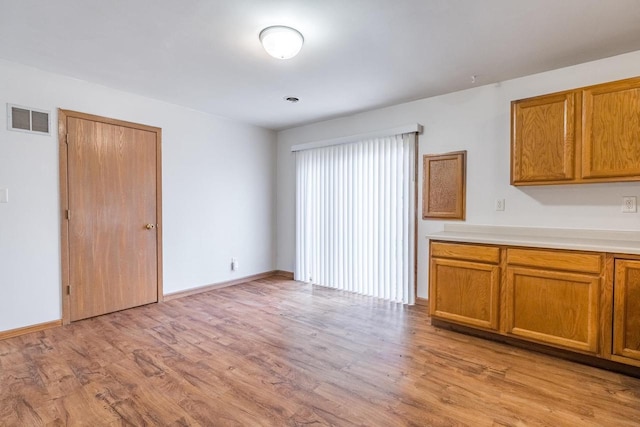 unfurnished living room with light wood-type flooring