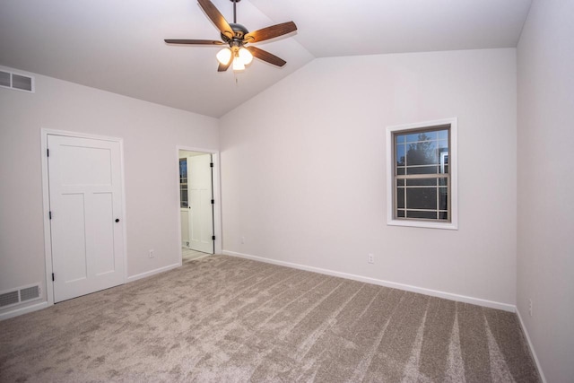 spare room with ceiling fan, carpet floors, and lofted ceiling