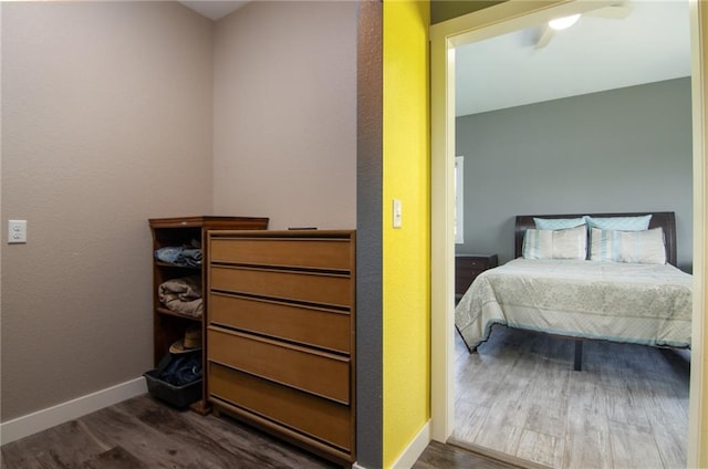 bedroom featuring dark hardwood / wood-style floors and ceiling fan