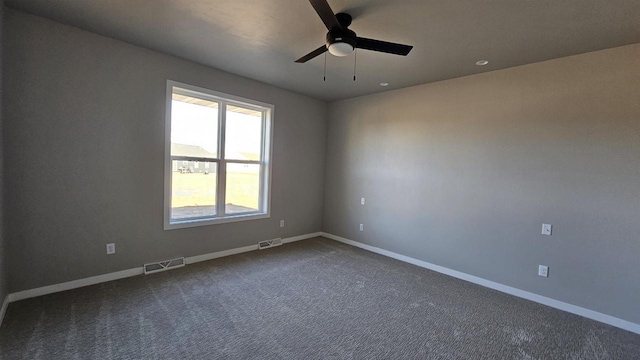 unfurnished room with ceiling fan and carpet